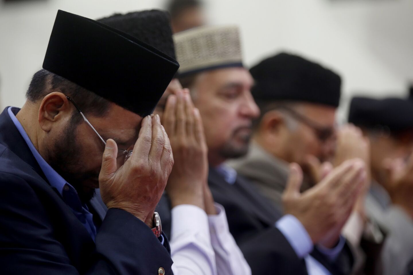 Zafar Basith prays at a vigil for the Orlando shooting victims at the Baitul Hameed Mosque in Chino.