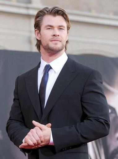 Chris Hemsworth, who plays the title character in "Thor," makes his way down the red carpet for the film's Hollywood premiere, held at the El Capitan Theatre.