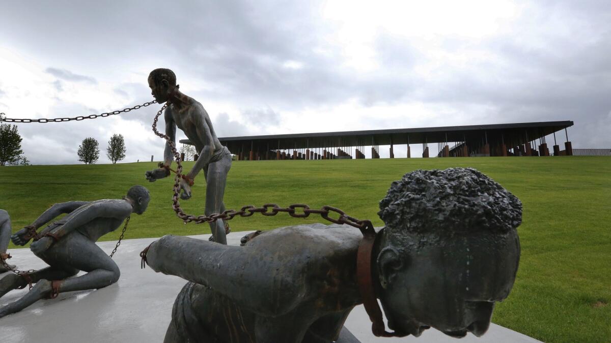 Part of a statue depicting slavery is on display at the National Memorial for Peace and Justice in Montgomery, Ala.
