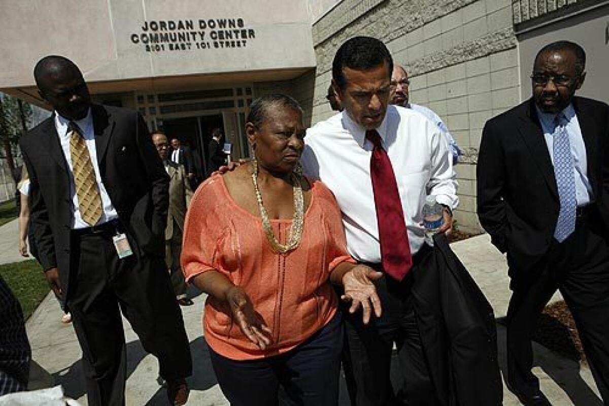 Jordan Downs community leader Betty Day, left, speaks with Mayor Antonio Villaraigosa on Wednesday. City officials want to replace the projects 700 units with as many as 2,100 units in mixed-use buildings that would house both low-income residents and those paying market rates.