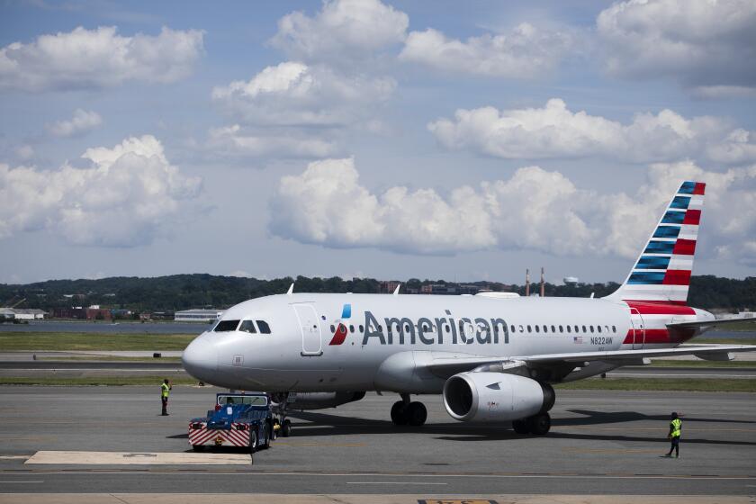 This June 2, 2021, photo shows an American Airlines aircraft at Ronald Reagan Washington National Airport in Arlington, Va. (AP Photo/Jenny Kane)