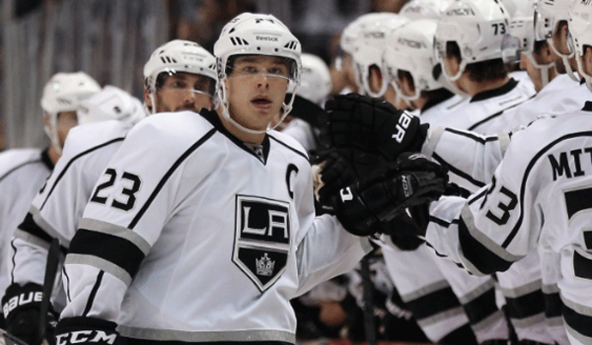 Kings captain Dustin Brown celebrates with his teammates after scoring against the Ducks at the Honda Center.