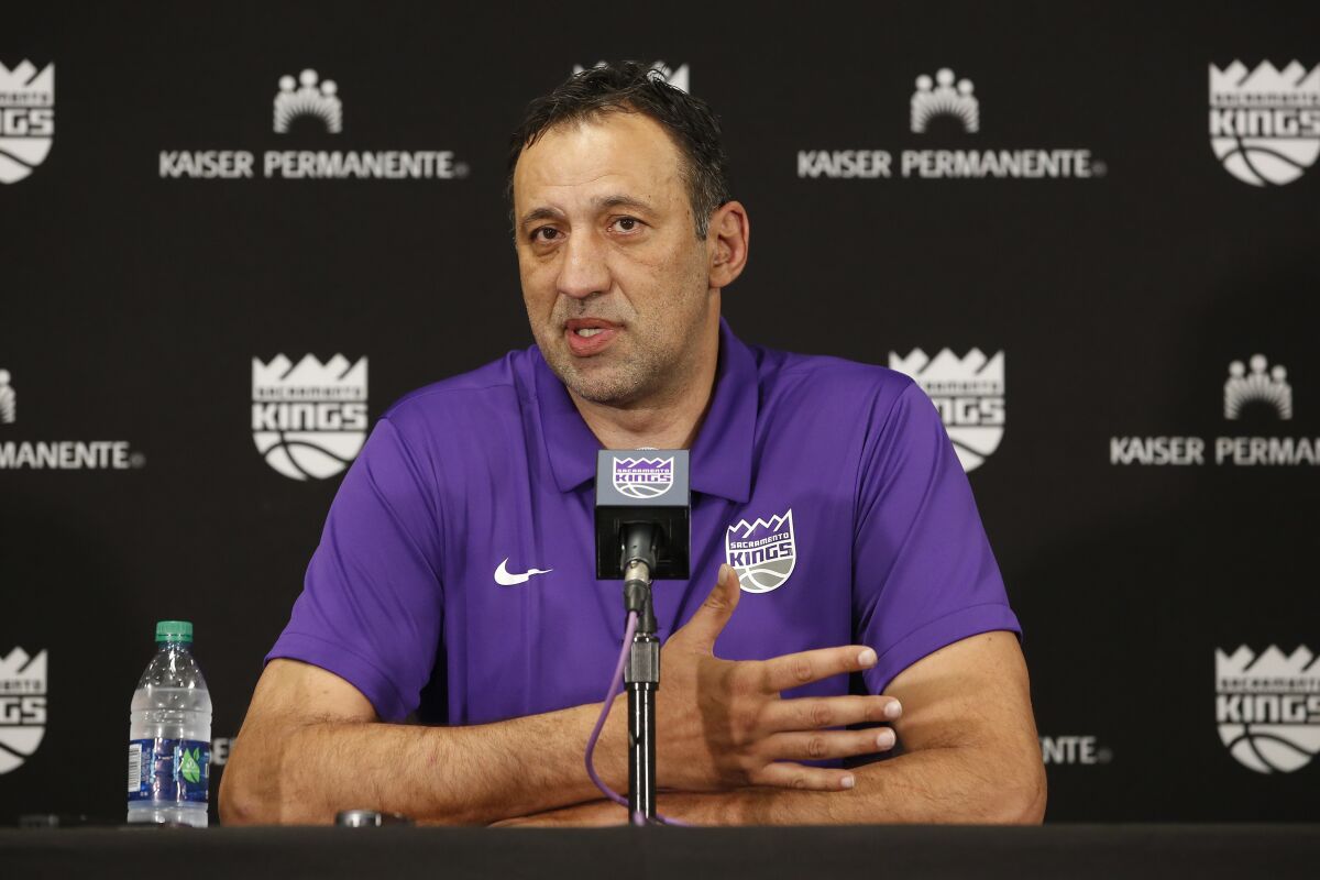 FILE - In this April 11, 2019, file photo, Sacramento Kings general manager Vlade Divac answers questions concerning the decision to fire coach Dave Joerger in Sacramento, Calif. Divac has stepped down as general manager of the Kings and will be replaced on an interim basis by Joe Dumars. The Kings announced the move Friday, Aug. 14, 2020, a day after they ended their 14th straight season without a playoff berth. (AP Photo/Rich Pedroncelli, File)
