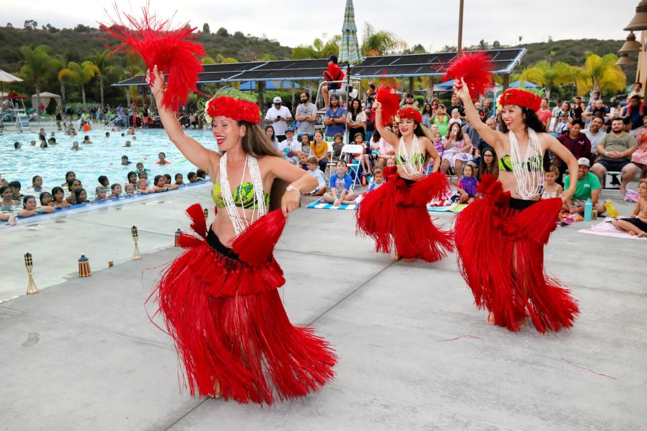 Hula performance, strange carnival costumes, inflatable activities