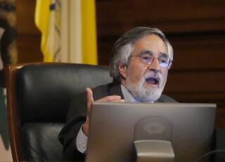 Supervisor Aaron Peskin speaks during a hearing.