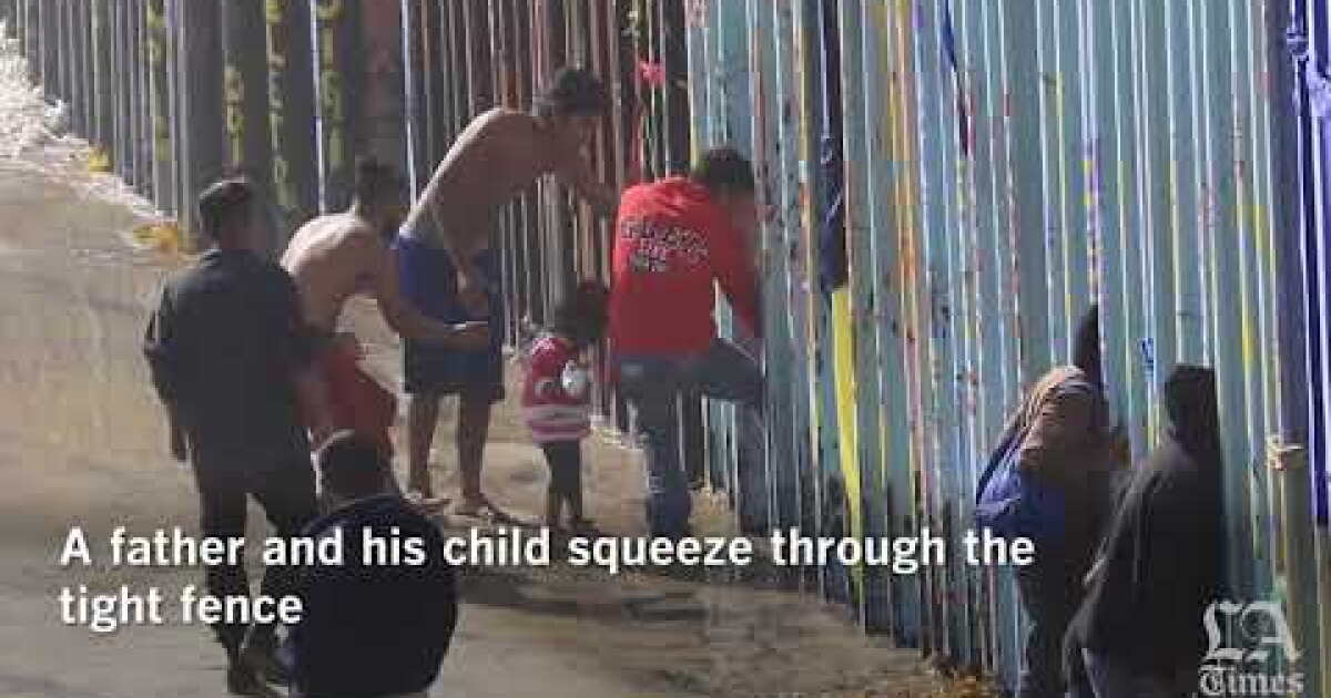 Dozens of migrants breach border fence at Pacific Ocean - Los Angeles Times