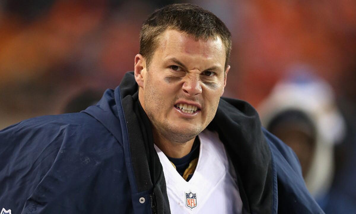 San Diego quarterback Philip Rivers reacts to a call in the fourth quarter while watching from the sidelines during the Chargers' 24-17 AFC division playoff loss to the Denver Broncos on Sunday.