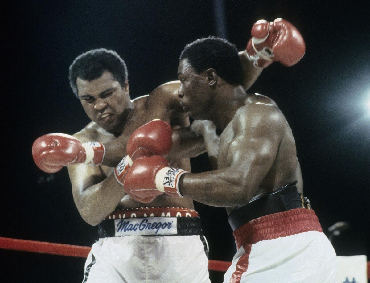 Trevor Berbick, right, throws a punch at Muhammad Ali on Dec. 11, 1981, at Queen Elizabeth Sports Centre in Nassau, Bahamas.