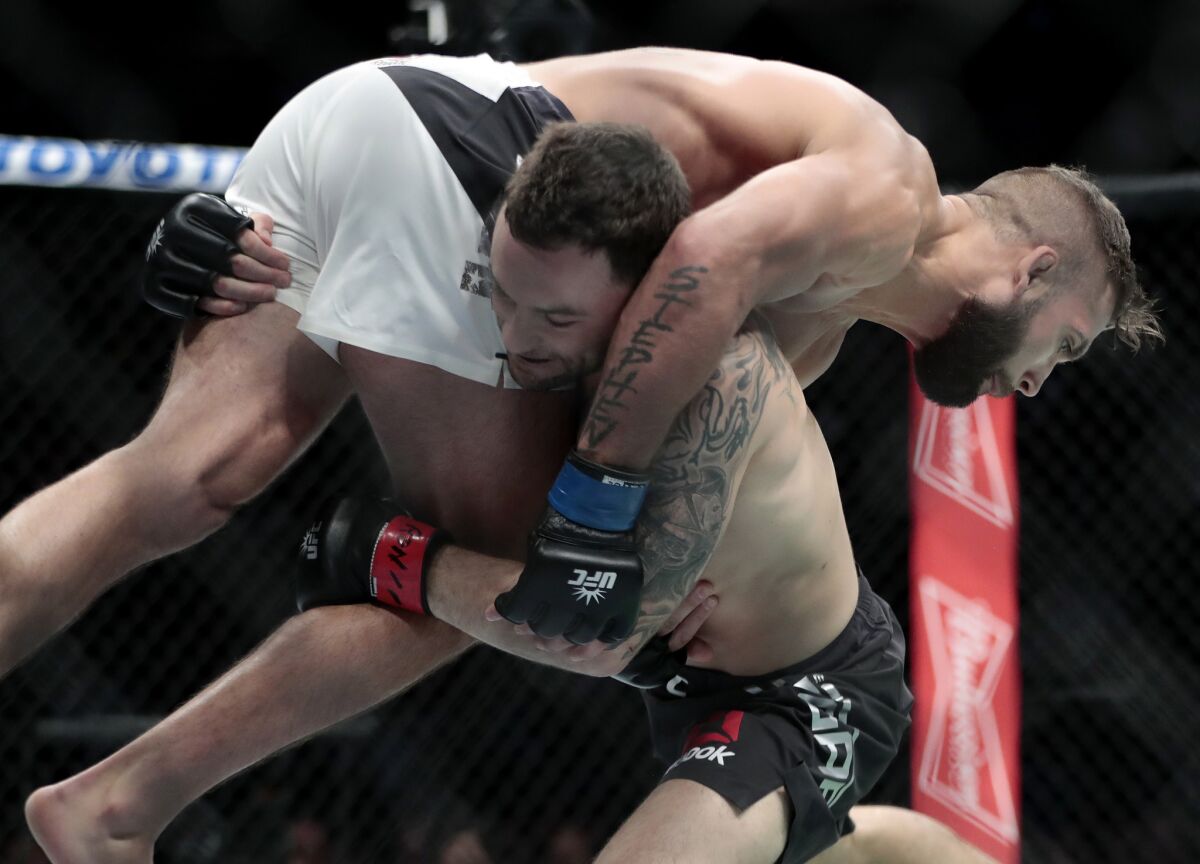 Frankie Edgar tries to take downJeremy Stephens during their featherweight bout at UFC 205.
