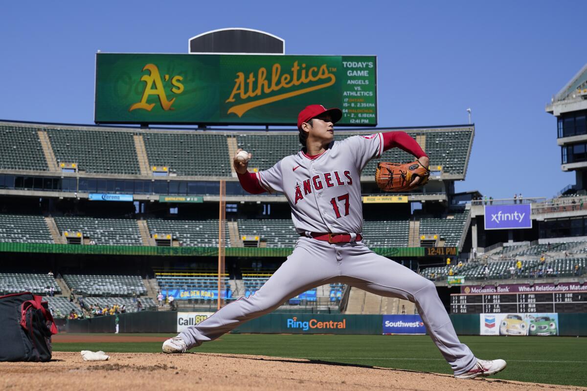 Angels starting pitcher Shohei Ohtani warms up before a game against the Oakland Athletics.