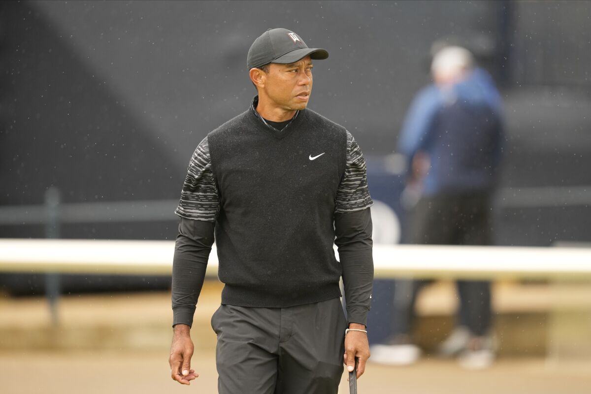 Tiger Woods of the US during a practice round at the British Open golf championship on the Old Course at St. Andrews, Scotland, Wednesday July 13, 2022. The Open Championship returns to the home of golf on July 14-17, 2022, to celebrate the 150th edition of the sport's oldest championship, which dates to 1860 and was first played at St. Andrews in 1873. (AP Photo/Gerald Herbert)