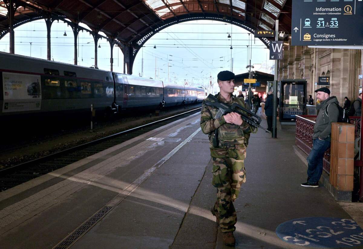 A French soldier patrols at the railway station in Strasbourg, eastern France following bomb attacks in Brussels that killed about 31 people and left more than 200 people wounded. Belgium's neighbours France, Germany and the Netherlands have tightened border security.