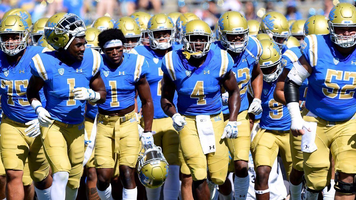 The UCLA Bruins head off the field before their game against the Oregon Ducks at the Rose Bowl on Oct. 21.