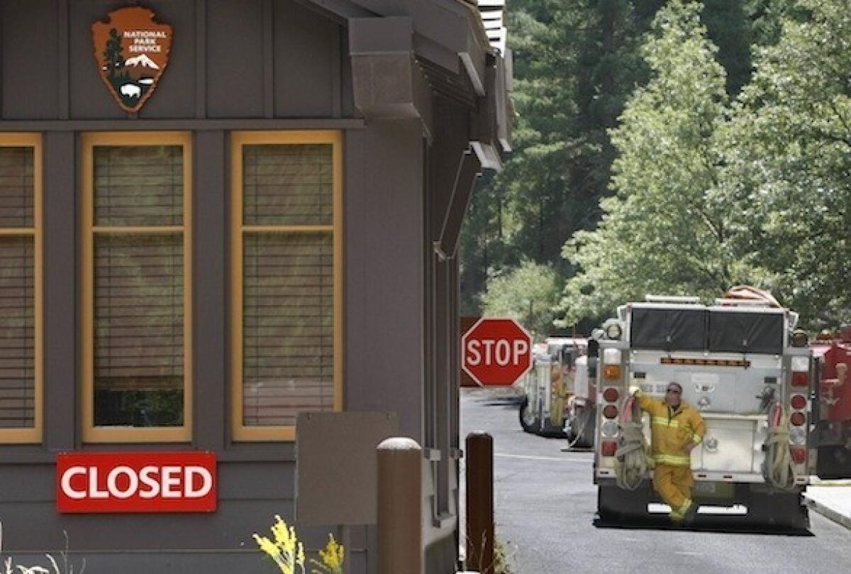 The western entrance to Yosemite National Park at Big Oak Flat remained shut Wednesday. Park officials also closed a portion of the park's major artery, Tioga Road, to aid fire suppression efforts.