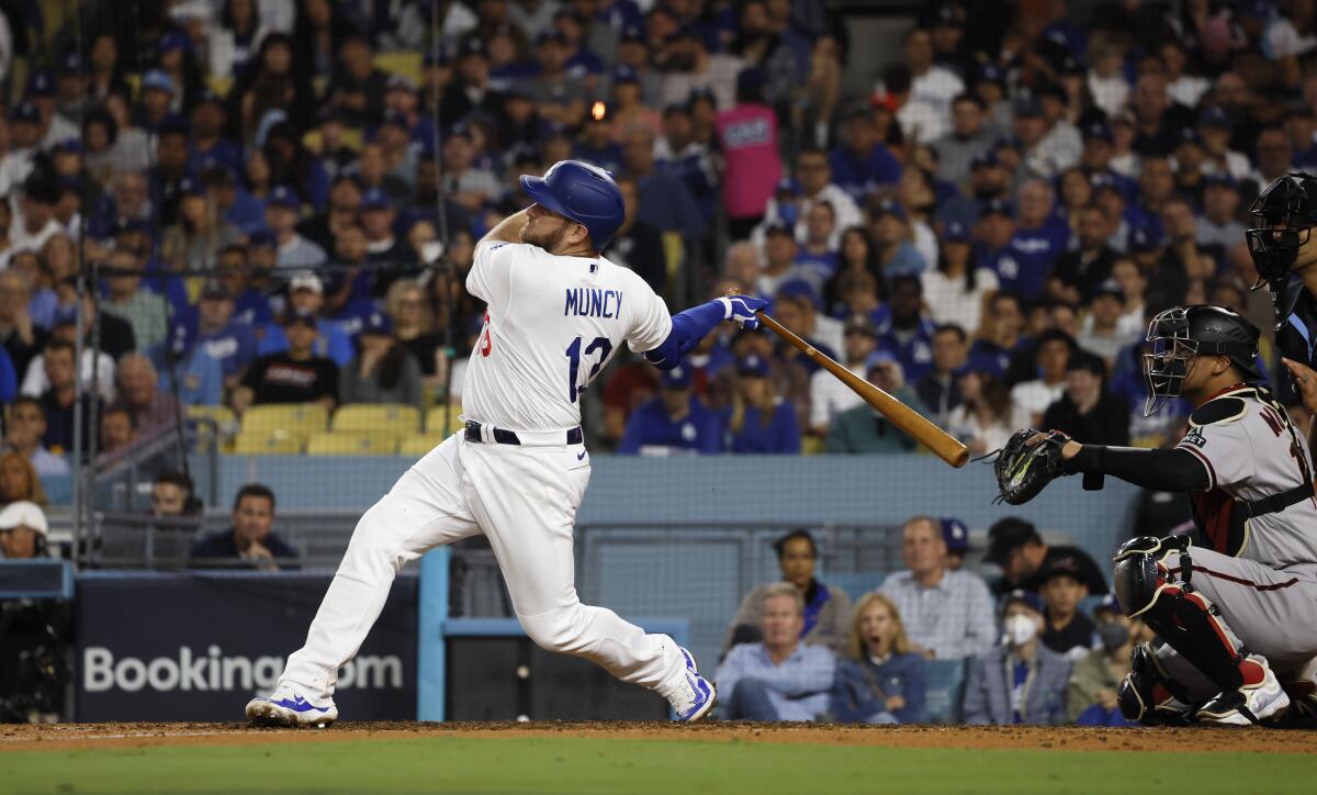 Max Muncy singles during the sixth inning in Game 2 of the NLDS against the Diamondbacks.