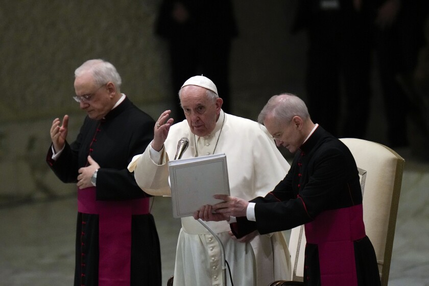 Pope Francis delivers his blessing at the Vatican on Wednesday,