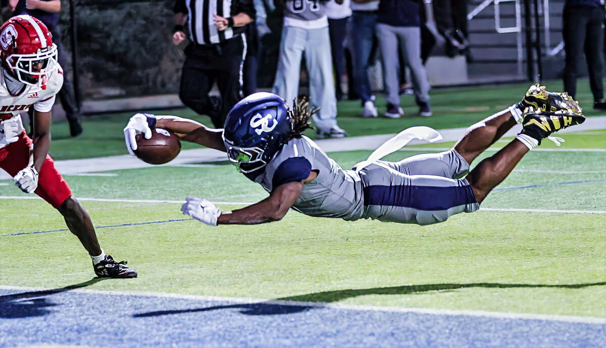 Sierra Canyon's Jaxsen Stokes dives into the end zone during a 28-10 win over Orange Lutheran.