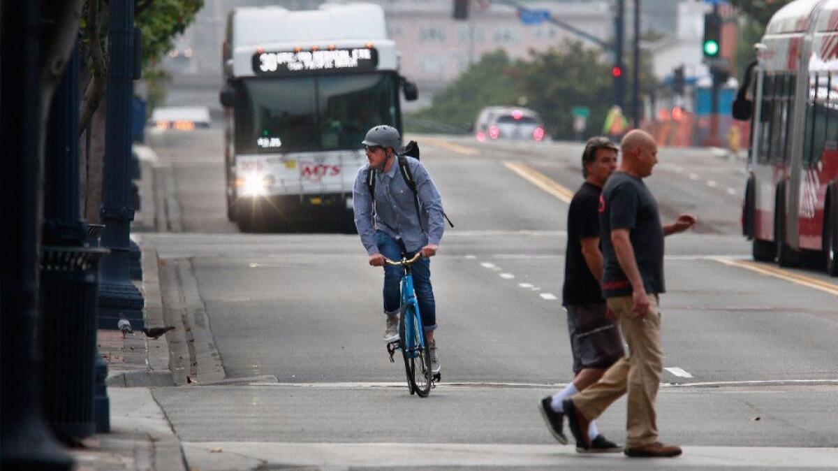 Most buses in San Diego have a rack on the front of the vehicle that accommodates two bicycles. Officials have looked into larger racks but run into challenges.