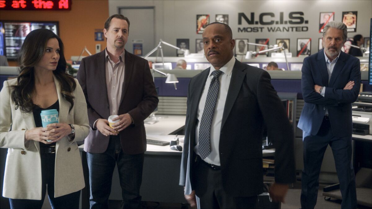 This image released by CBS shows, from left, Katrina Law as NCIS Special Agent Jessica Knight, Sean Murray as Special Agent Timothy McGee, Rocky Carroll as NCIS Director Leon Vance, and Gary Cole as FBI Special Agent Alden Parker in a scene from "NCIS." (CBS Entertainment via AP)