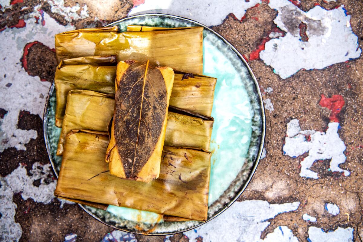 Banana leaf-wrapped Oaxacan tamales from Poncho's Tlayudas in South Los Angeles.