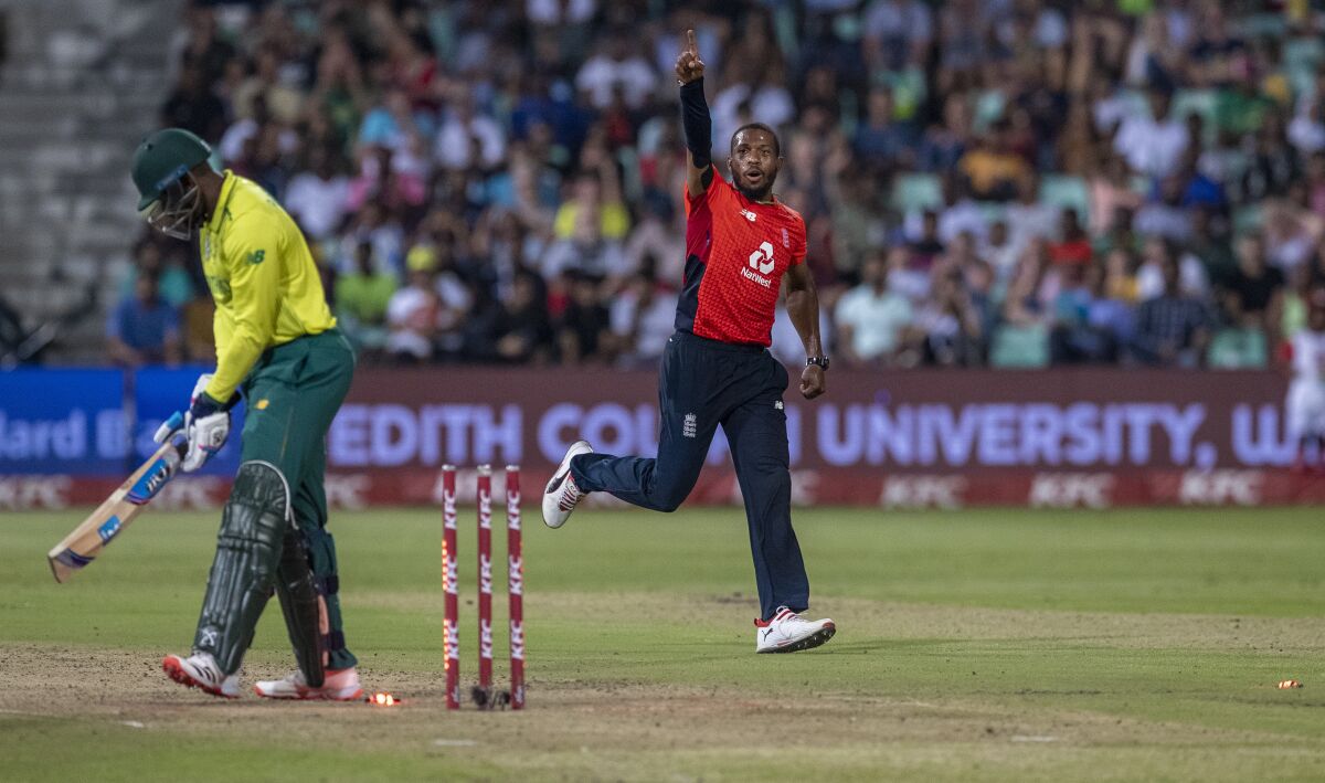 England's bowler Chris Jordan, right, celebrates after bowling South Africa's batsman Andile Phehlukwayo for a duck during the 2nd T20 cricket match between South Africa and England at Kingsmead stadium in Durban, South Africa, Friday, Feb. 14, 2020. (AP Photo/Themba Hadebe)