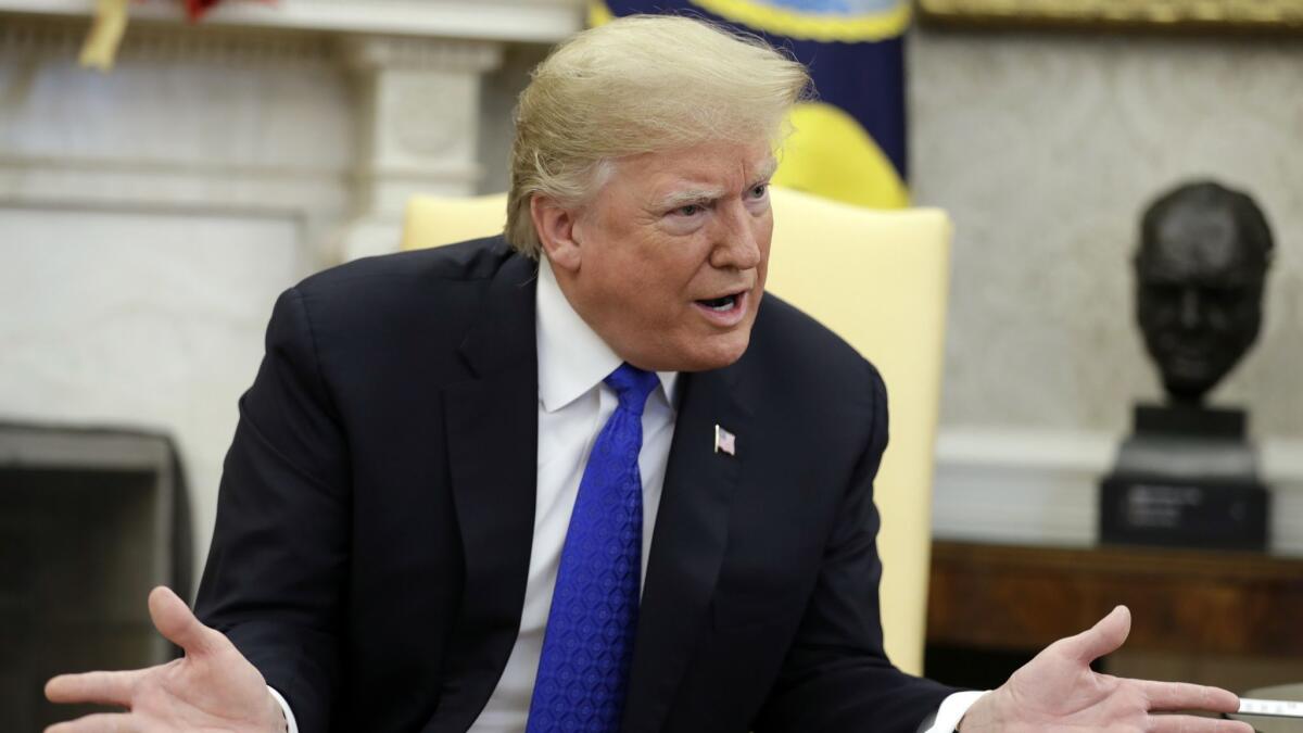 President Trump speaks during a meeting in the Oval Office in Washington on Dec. 11.