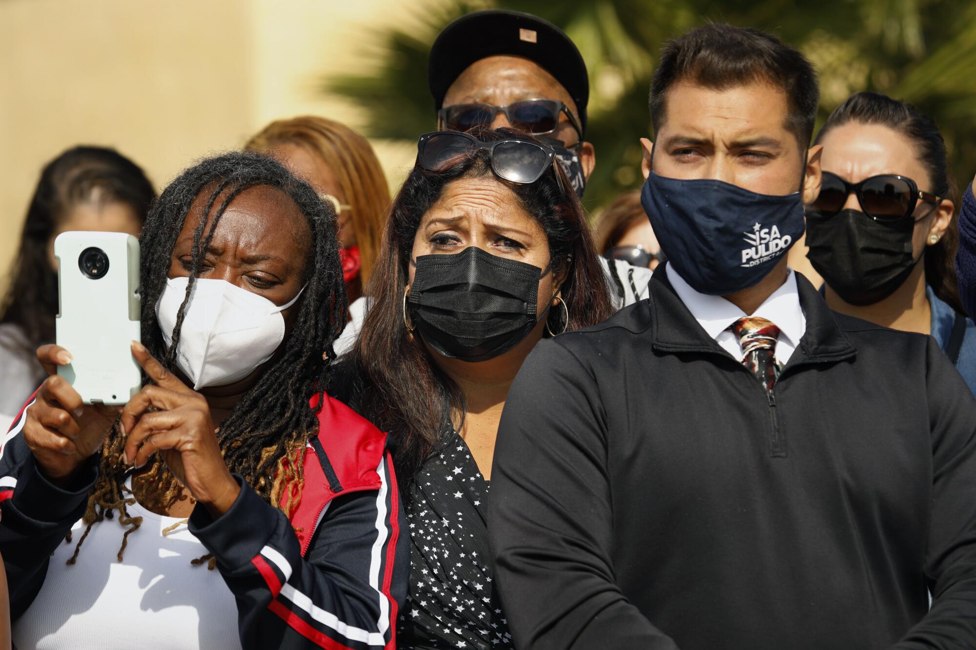 Carson residents gather beside the Dominguez Channel