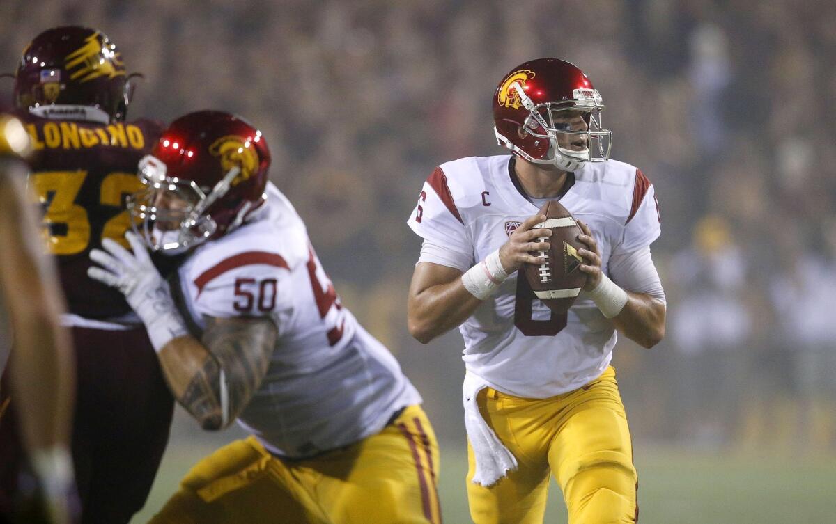 USC's Cody Kessler, right, looks for an open receiver against Arizona State on Saturday.