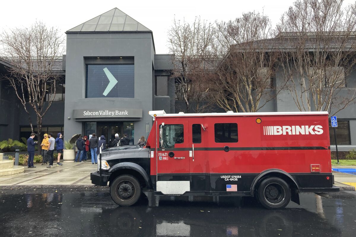 A Brinks truck is parked outside of Silicon Valley Bank in Santa Clara on March 10.