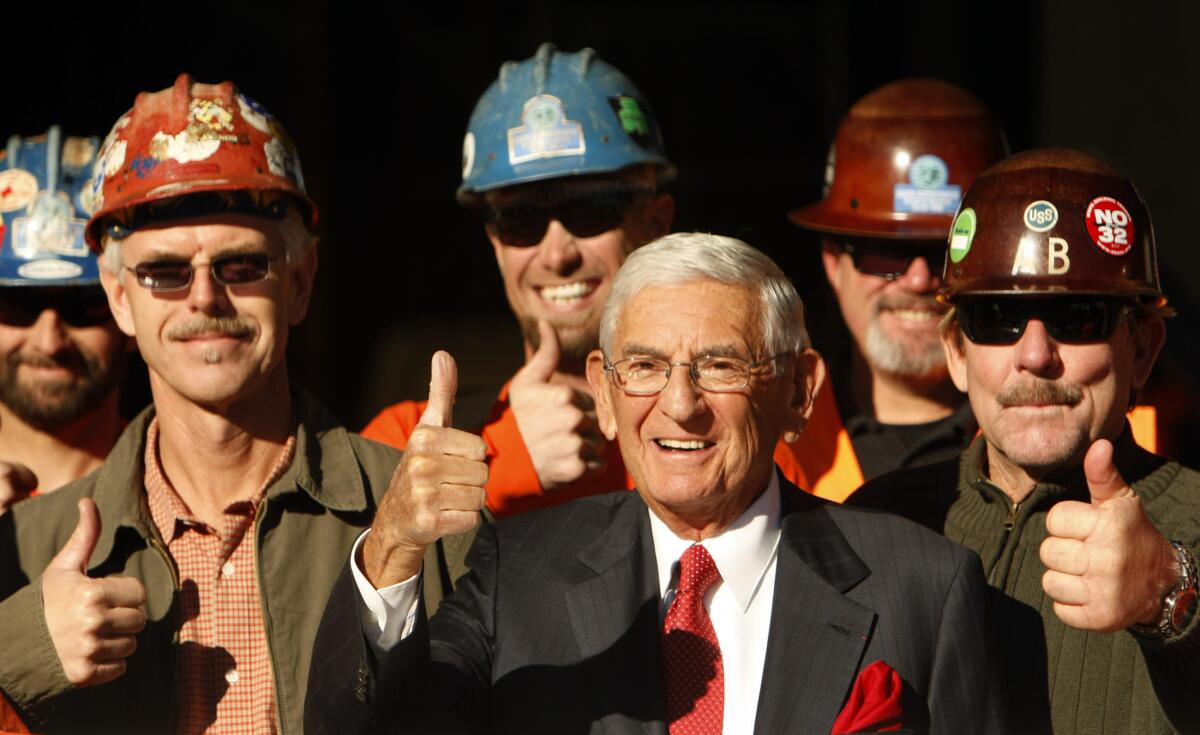 Eli Broad is surrounded by union construction workers at a ceremony for the Broad Museum in downtown Los Angeles in 2013.