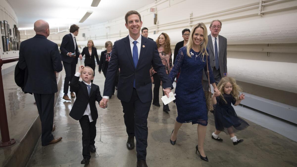 Rep. Mike Levin (D-San Juan Capistrano) walks in the tunnels beneath the Capitol building with his wife, Chrissy, and their two children.