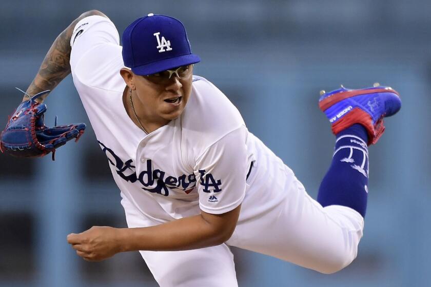 Los Angeles Dodgers starting pitcher Julio Urias follows through during the first inning of the team's baseball game against the Milwaukee Brewers on Friday, April 12, 2019, in Los Angeles. (AP Photo/Mark J. Terrill)