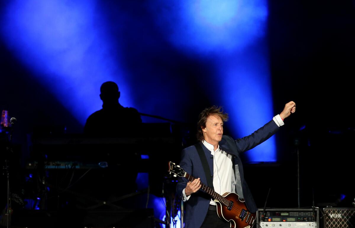 Paul McCartney, seen performing at Desert Trip in 2016, is suing music publisher Sony/ATV in an attempt to regain rights to the lucrative Beatles catalog.