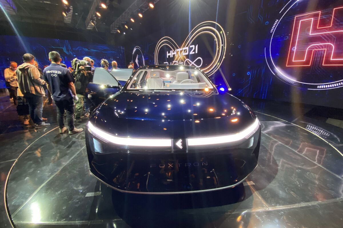 One of the electric cars unveiled by Foxconn is seen during a press event held in Taipei, Taiwan Monday, Oct. 18, 2021. The Taiwanese company that manufactures smartphones for Apple Inc. and other global brands announced Monday plans to produce electric cars for auto brands under a similar contract model. (AP Photo/Wu Taijing)