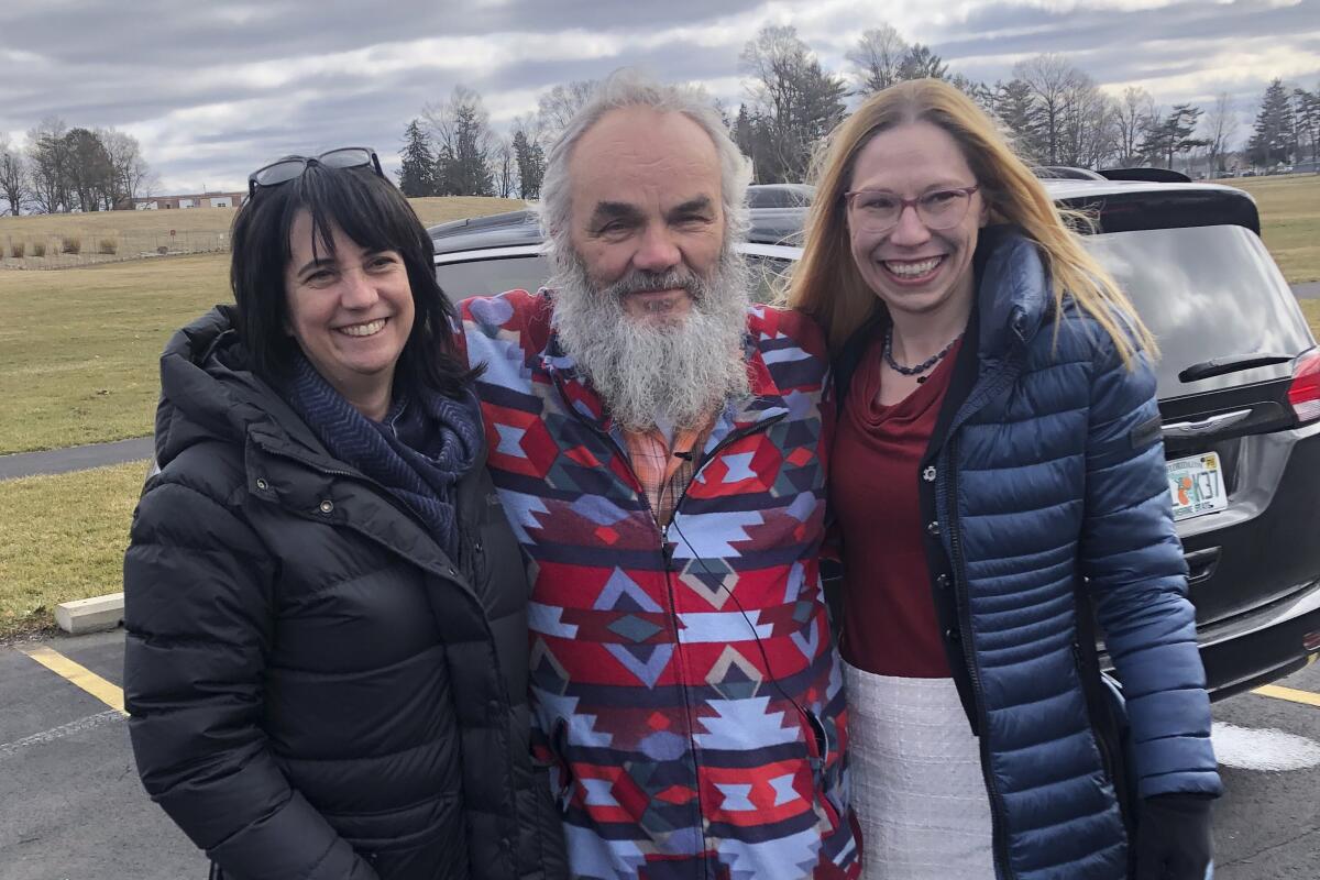 Released prisoner Jeff Titus with two supporters