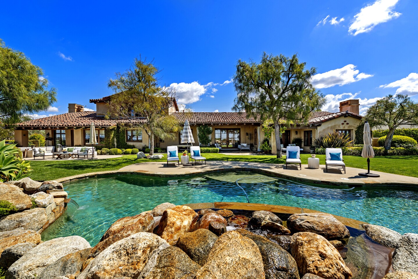 Former Chargers quarterback Philip Rivers is seeking $4.199 million for his Spanish-style estate in the Santaluz community of San Diego. The one-acre property sits behind gates and features a putting green, a resort-style swimming pool, lawn and golf course views. Built in 2005 and since updated, the single-story house has more than 6,800 square feet of living space with six bedrooms and 6.5 bathrooms.