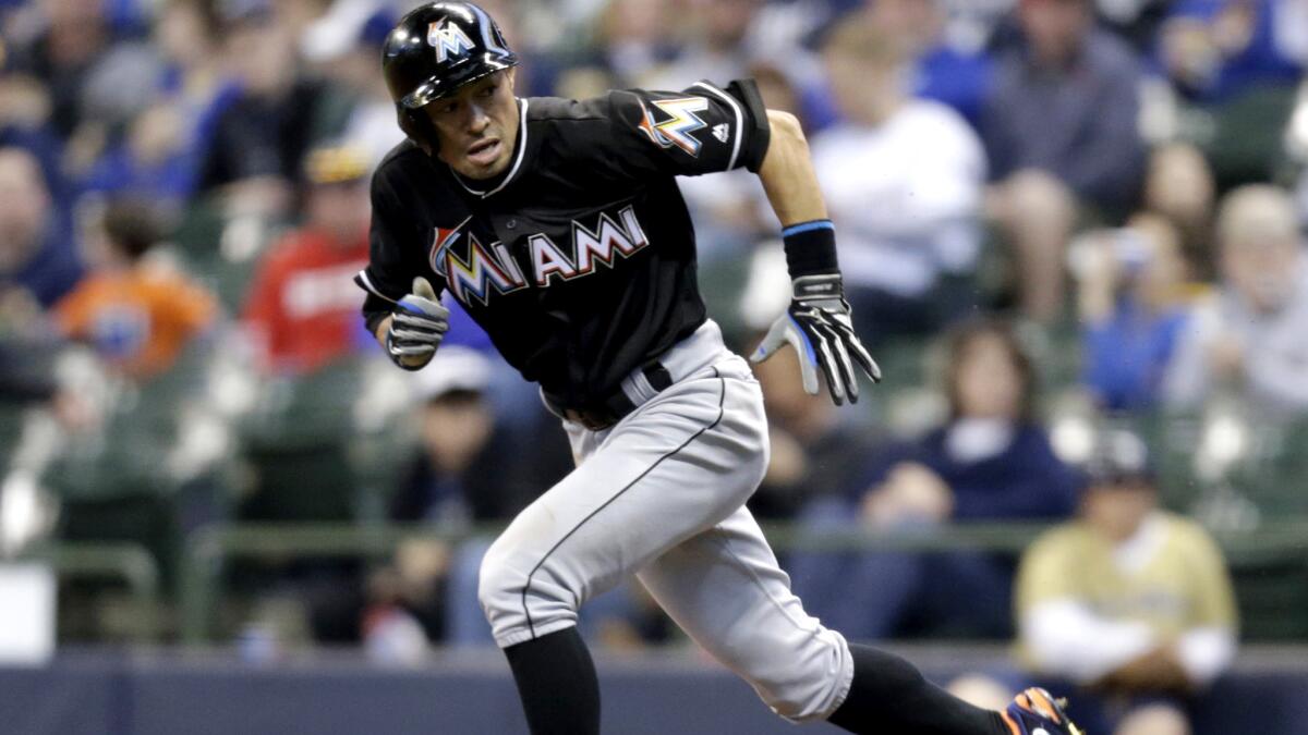 Marlins outfielder Ichiro Suzuki steals his 500th career base during the first inning Friday in Milwaukee.