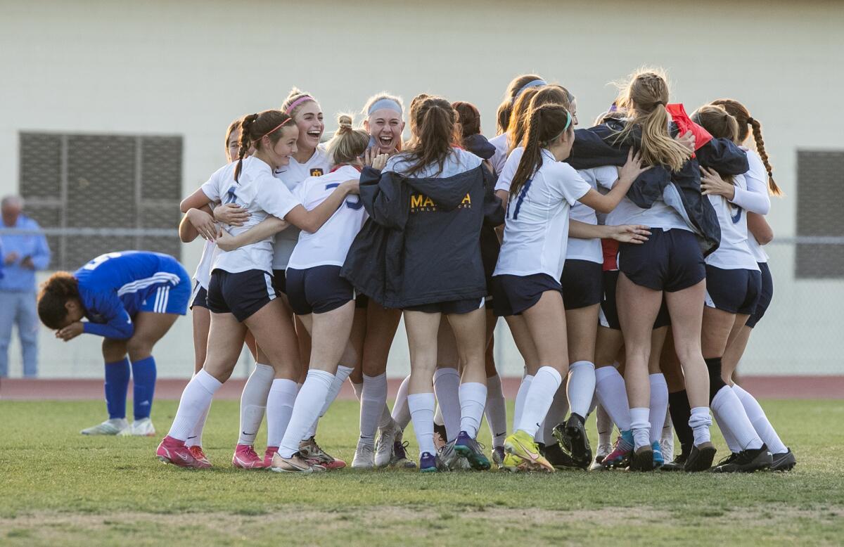 Marina celebrates after beating Bishop Amat in a CIF Southern Section Division 3 semifinal on Friday.