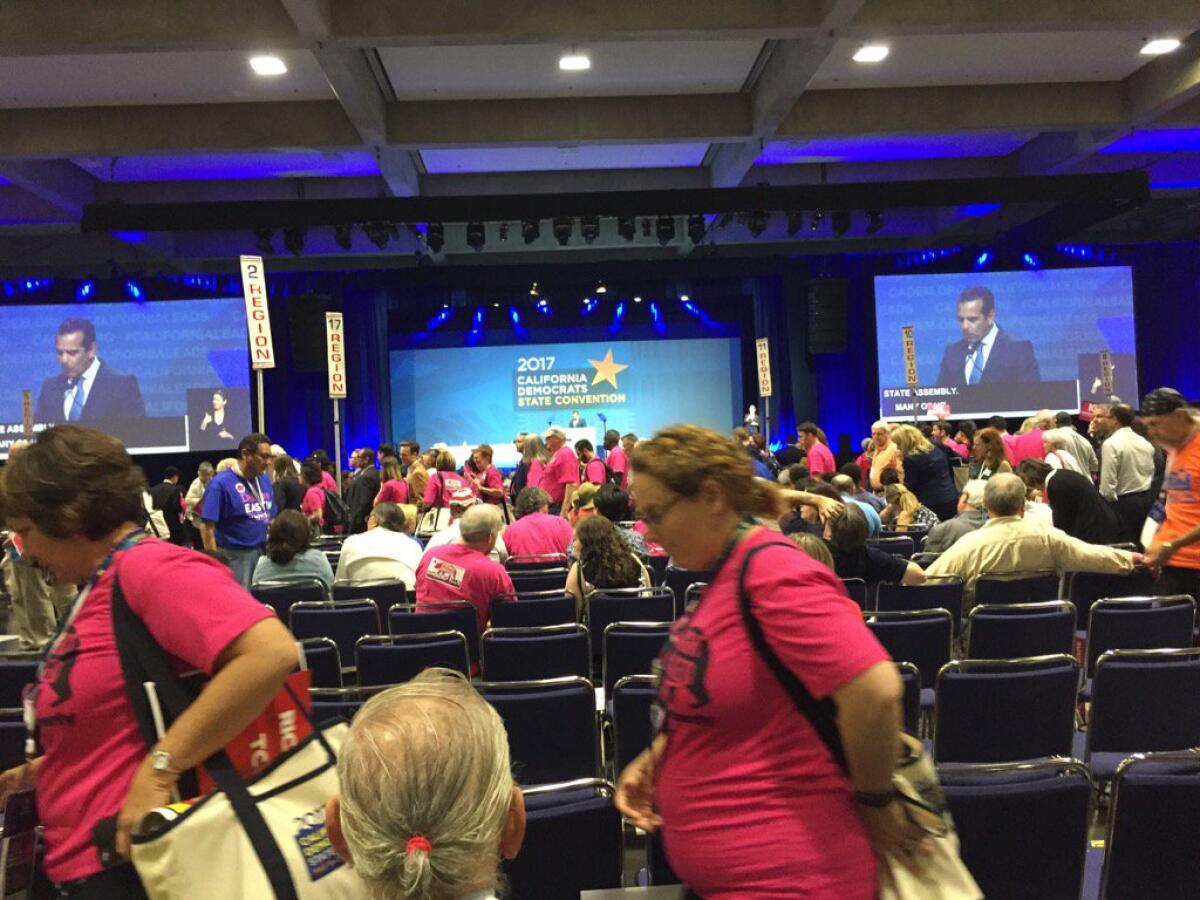 Democratic delegates at the state party convention begin to file out during an address by former Los Angeles Mayor Antonio Villaraigosa