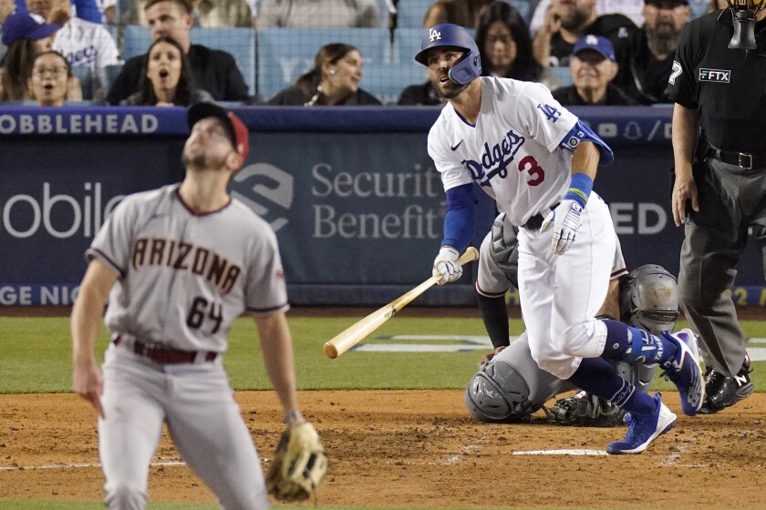 The Dodgers' Chris Taylor watches his two-run home run off Arizona Diamondbacks reliever Sean Poppen on May 16, 2022.