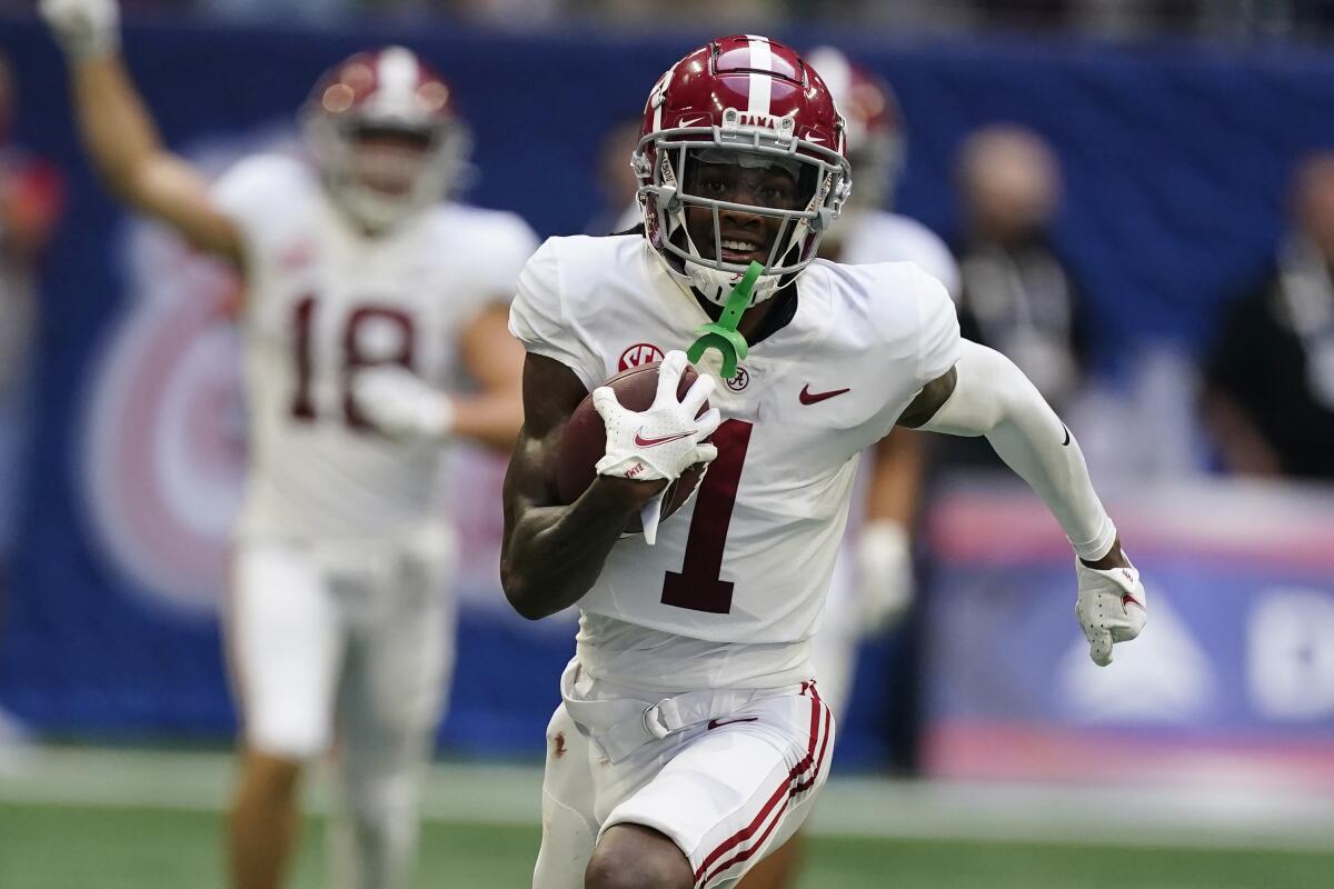 Alabama wide receiver Jameson Williams scores a touchdown against Miami on Saturday.