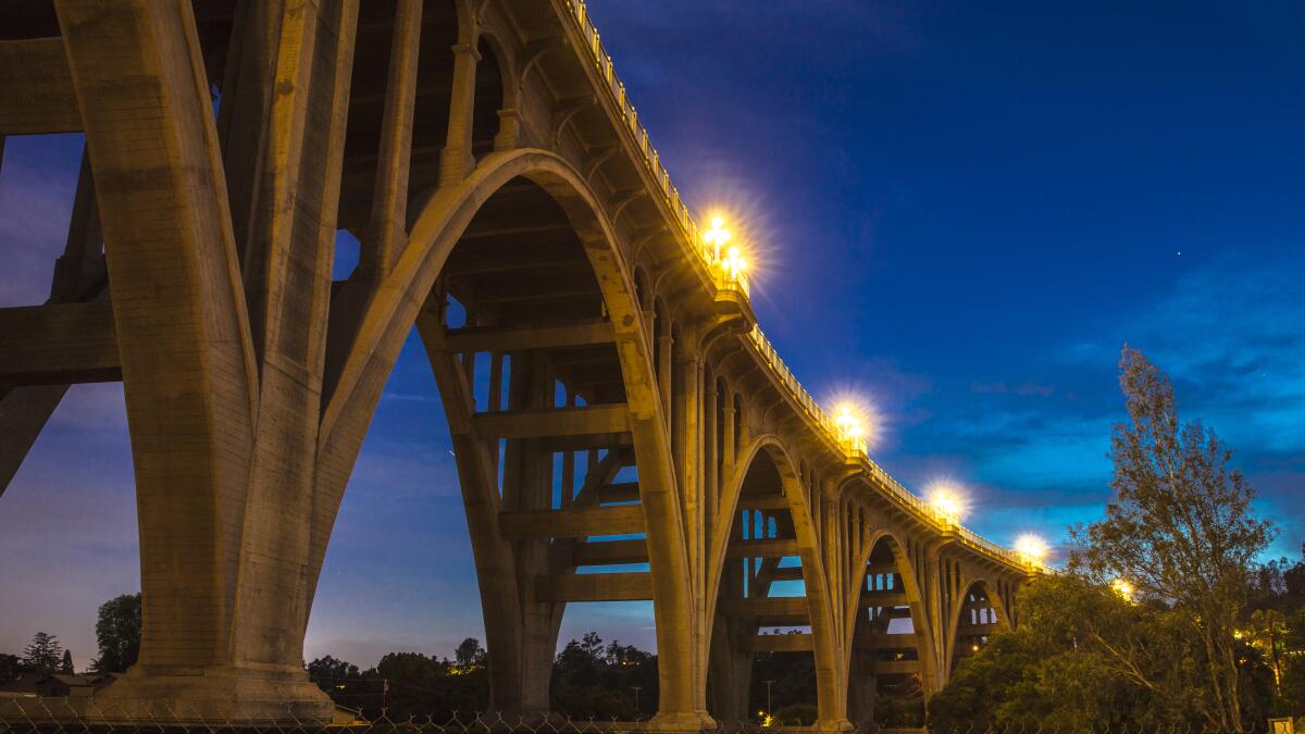 The historic Colorado Bridge arches at dusk.