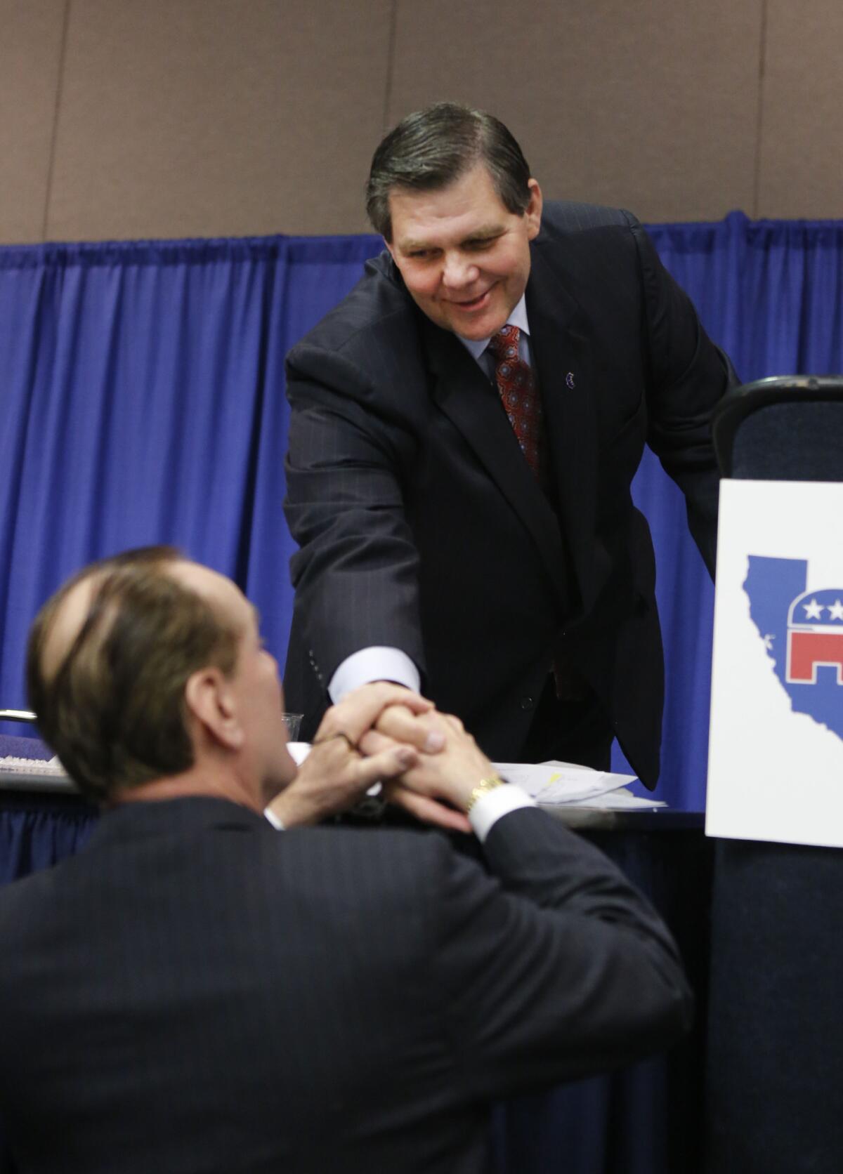 Former state Sen. Jim Brulte of Rancho Cucamonga, right, receives congratulations after his election as California Republican Party chairman during the CRP convention in Sacramento in 2013.