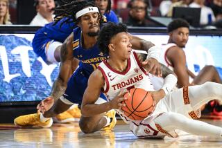 Los Angeles, CA - November 09: Cal State Bakersfield's Marvin McGhee III reaches over USC's.