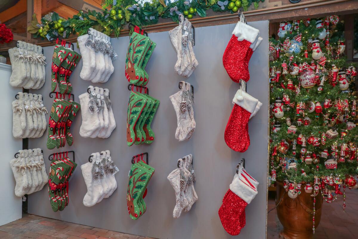 Christmas décor, including stockings, at Roger's Gardens Christmas Boutique.