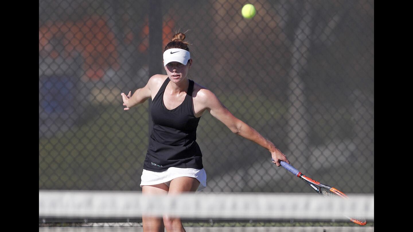 Sage Hill School's Morgan Mann follows through with a backhand in a No. 1 singles set against St. Margaret’s during a San Joaquin League match in Newport Beach on Tuesday, Oct. 16.