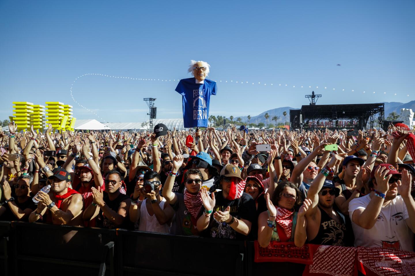 A mask of Democratic presidential candidate Bernie Sanders was held above the crowd during the performance of rap duo Run the Jewels, at the Coachella Valley Music and Arts Festival, April 23, 2016.