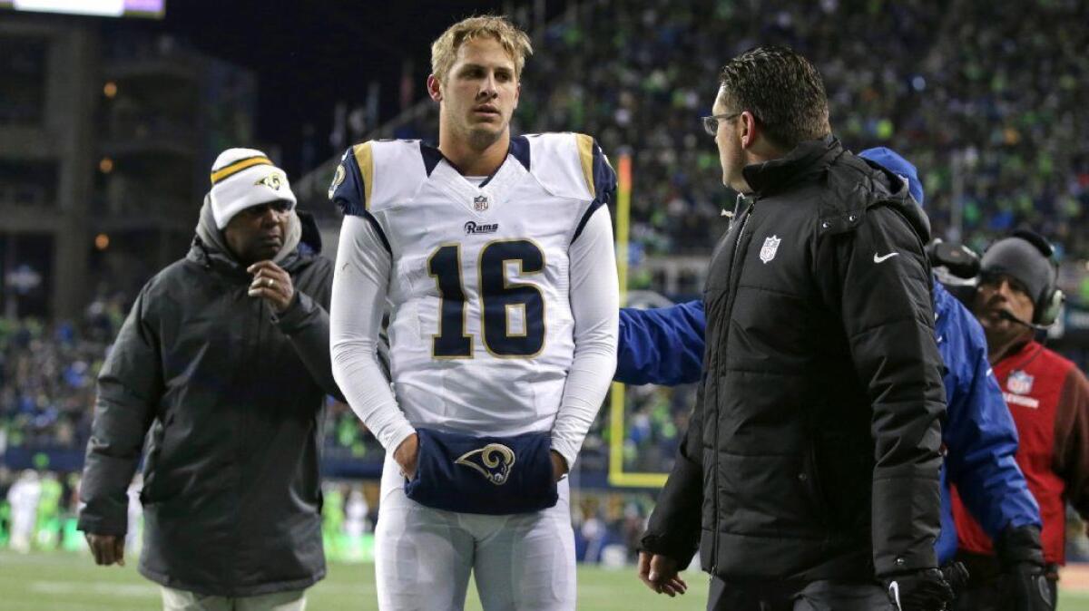 Rams quarterback Jared Goff leaves the game against the Seahawks after taking a big hit from Seattle cornerback Richard Sherman during a game on Dec. 15.