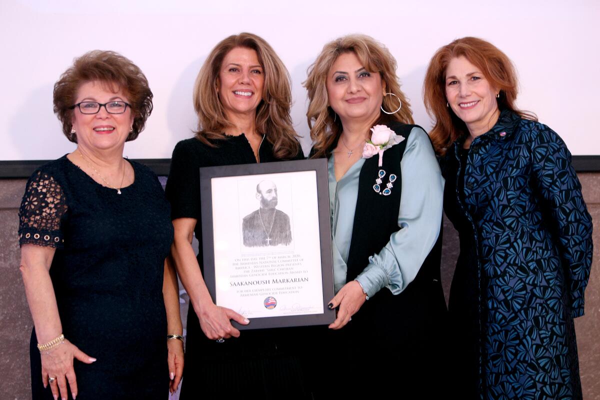 R.D. White Elementary School teacher Saakanoush Markarian, second from right, won the Zaruhy "Sara" Chitjian Armenian Heritage Award at the annual Armenian Genocide Education Awards Luncheon, in Burbank on Saturday. Left to right are Alice Petrossian, Hermineh Pakhanians, Markarian and Roxanne Makasdjian.