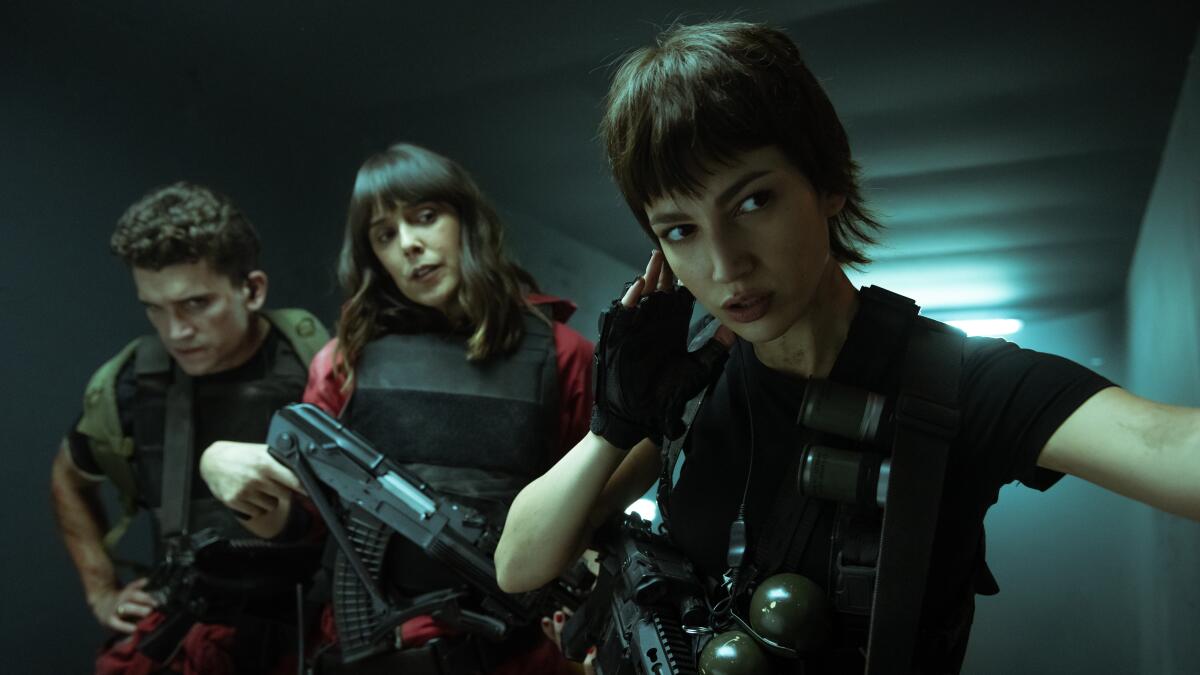 (L to R) Jaime Lorente, Belen Cuesta, and Ursula Cobrero in "Money Heist."